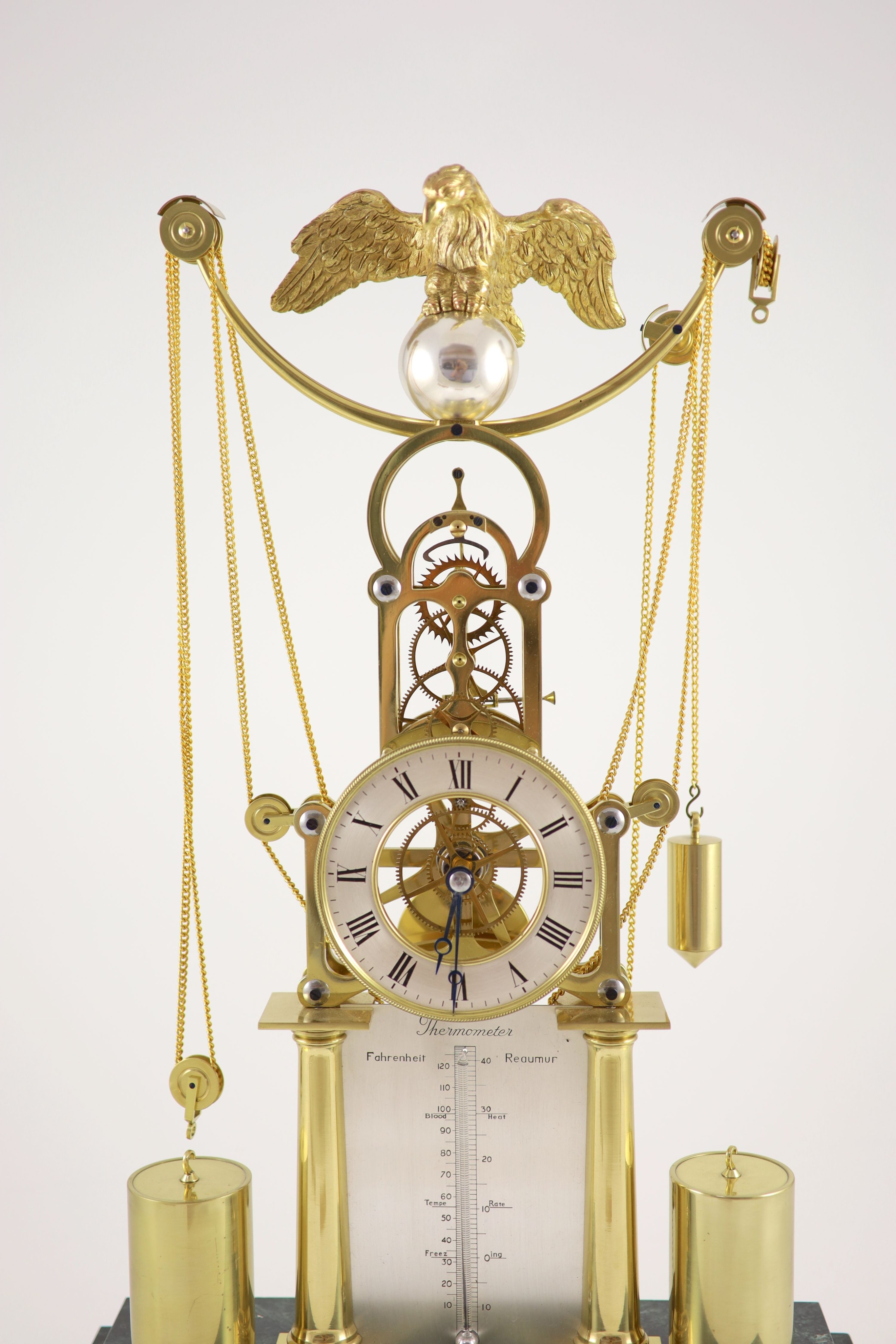 An F.H.Whitlock Empire style brass skeleton clock H 54cm. W 35cm. D 16cm.